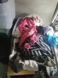 Pile of clothing packed out of a bedroom